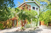 Beachfront abode with well-equipped kitchen - pool, beach, grill, & canoe access