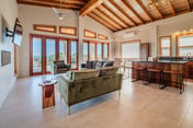 Tropical retreat villa with a pool, dock, bikes, canoes, balconies, and 360 views