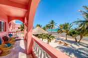 Beachfront condo with beach access, dock, pool, balcony, & ocean views