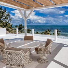 Luxurious beachfront home with private pool, rooftop grill, and sea views