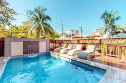 Air-conditioned suite with WiFi and a shared pool & terrace - walk to the beach
