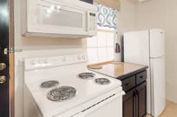 Homey suite in town w WiFi, partial AC, shared pool & veranda - walk to beach