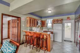 Cozy Waterfront Villa Home w Shared Pool, Water Views, WiFi, & AC - Walk to the Beach