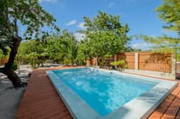 Beachfront abode with well-equipped kitchen - pool, beach, grill, & canoe access