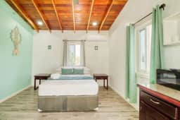 Island studio centrally located with balcony, hammock, & grill