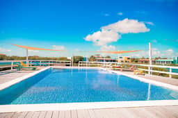 Waterfront villa with outdoor pool, washer dryer, & central AC