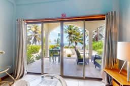 Ground-floor ocean-view condo with dock, pool, full kitchen, & AC