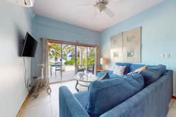 Ground-floor ocean-view condo with dock, pool, full kitchen, & AC