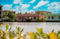 Beautiful lake-view villa with balcony, pool, & partial AC - near dining & shops