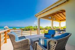 Tropical retreat villa with a pool, dock, bikes, canoes, balconies, and 360 views