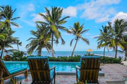 Relaxing condo with shared pool, ocean views, partial AC & WiFi