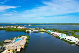 Comfortable condo with lagoon-view balcony, WiFi, AC & pool access