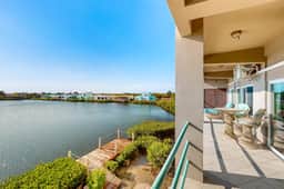 Comfortable condo with lagoon-view balcony, WiFi, AC & pool access