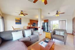 Sunny waterfront villa with outdoor pool, balcony, & AC