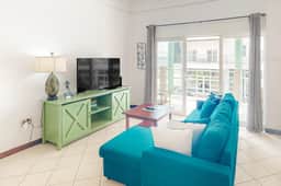 Stylish condo near the beach with pool, fast WiFi, partial ocean views & AC