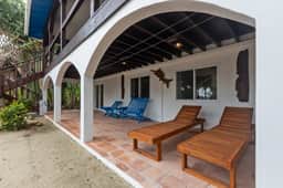 Beachfront home with dock, deck, hammocks, strong WiFi, AC & sea view