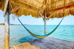 Romantic beachfront home w ocean views, dock, hammock, veranda & free WiFi