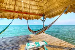 Romantic beachfront home with ocean views, dock, free WiFi, and outdoor dining