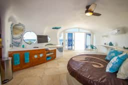 Lagoon-front studio with water access, infinity pool, & AC