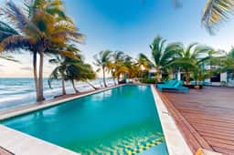 Charming beachfront condo with a kitchenette, shared pool, WiFi, & beach access