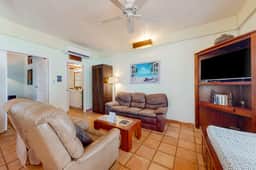 Colorful oceanfront condo with shared pool, WiFi, ocean view, and central AC