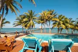 Ocean view condo at beachfront complex with AC, free WiFi, & pool