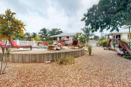 Wood cabana with a porch, pool view, WiFi, and a shared common area with grills