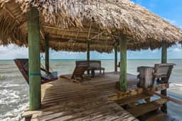Tropical beachfront getaway with private pool, ocean views & enclosed yard