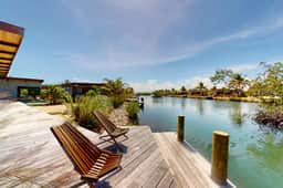 Elegant waterfront villa with private terrace, pool, beach access & 4 en-suites