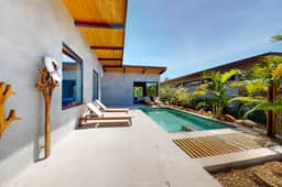 Elegant waterfront villa with private terrace, pool, beach access & 4 en-suites
