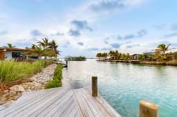 Waterfront villa with pool, spacious deck, dog-friendly & office space