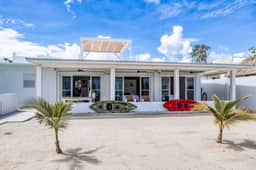 Luxurious beachfront home with private pool, rooftop grill, and sea views