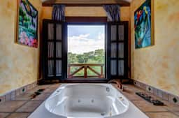 Riverfront Retreat with Balcony, WiFi, Partial AC, Shared Pool