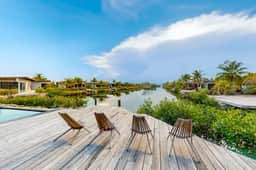 Tranquil waterfront villa with private deck & full kitchen