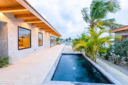 Waterfront villa with splash pool, private terrace, beach access & WiFi