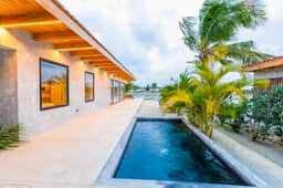 Relaxing tropical villa with private plunge pool, open layout & canal water view