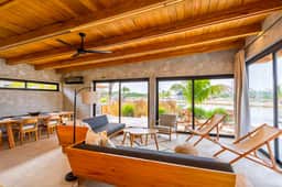 Relaxing tropical villa with private plunge pool, open layout & canal water view