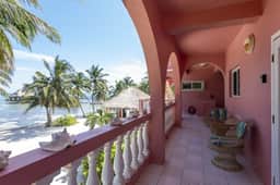 Breezy 2-story oceanfront condo with pool, sea views & partial AC