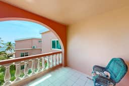 Two-story, ocean view condo w shared pool, two balconies, WiFi & partial AC