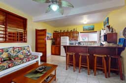 Ocean view condo w shared pool, free WiFi & partial AC - steps from the ocean
