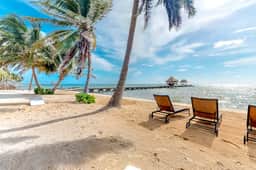 Garden-view condo steps to the beach with pool, dock & AC - snowbird-friendly