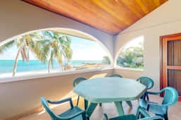 Family-friendly beachfront condo w shared pool & dock, sea view, WiFi & partial AC