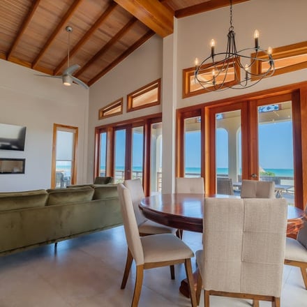 Dining room with cathedral ceiling and ocean view