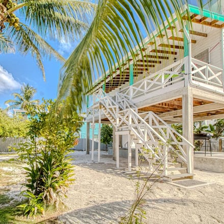 White beach house on stilts, Caye Caulker