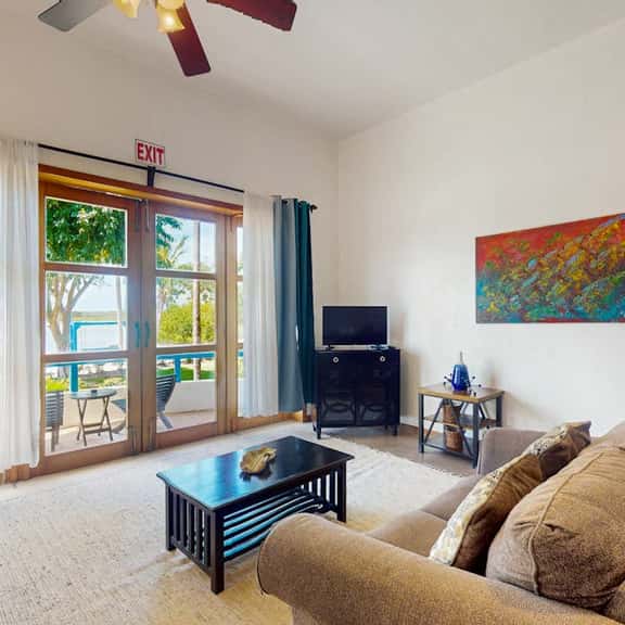 Charming Apartment with Idyllic Waterfront Views and Outdoor Pool Access - Image 1