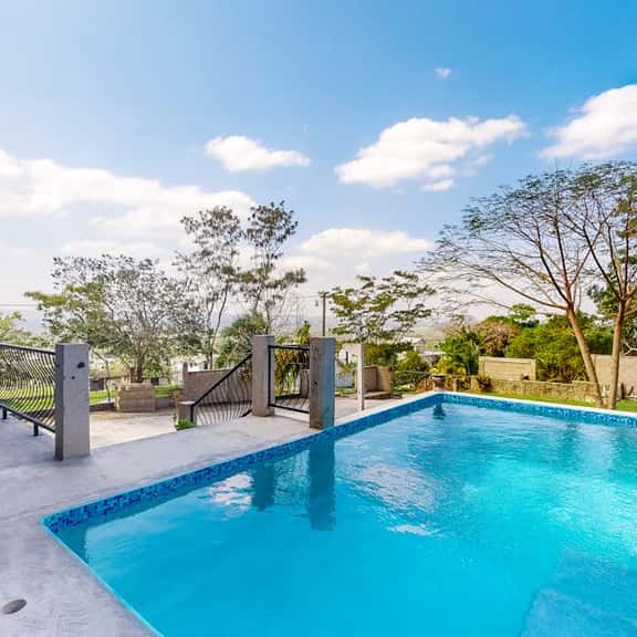 Enchanting home with pool, volleyball, mountain & city views & AC - Image 1