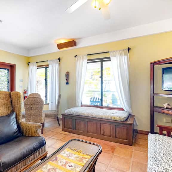 Charming, beachfront condo with shared outdoor pool, central AC, & free WiFi - Image 1