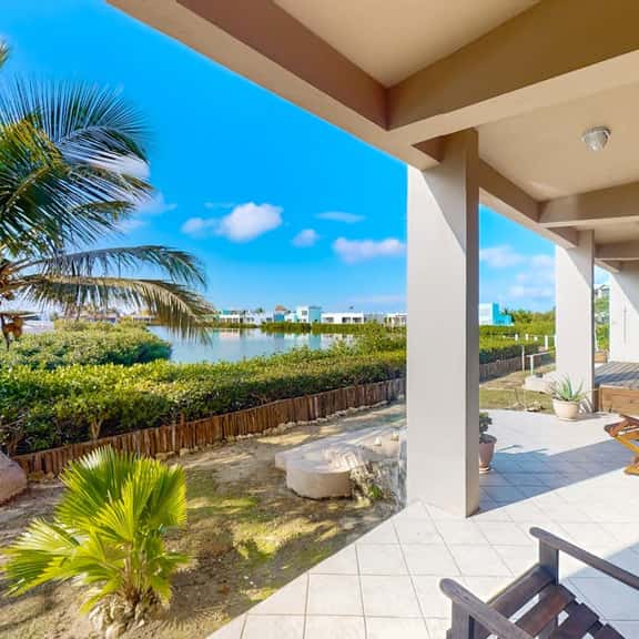 Vibrant, colorful lagoon-front suite with pool access, scenic patio, & WD - Image 1