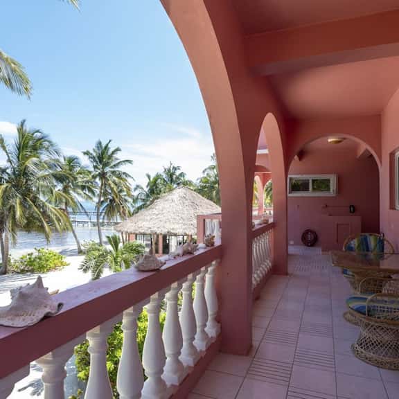 Breezy 2-story oceanfront condo with pool, sea views & partial AC - Image 1