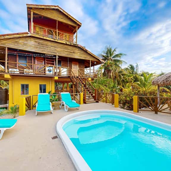 Waterfront villa with private pool, balcony, partial AC, fast WiFi - near beach - Image 1